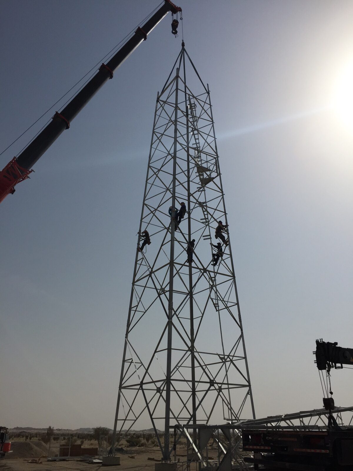 Communications tower installation by a field team